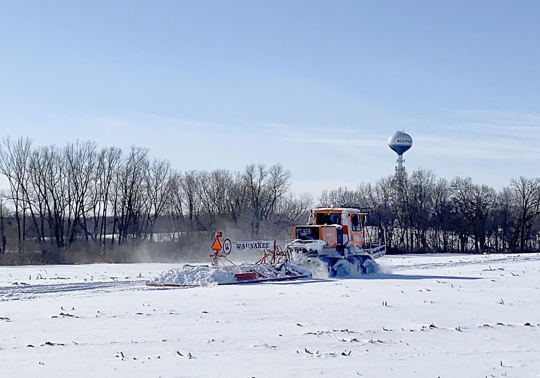 Grooming the snowmobile trail